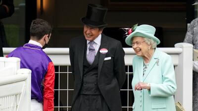 Queen Elizabeth II and racing manager John Warren speak with jockey Oisin Murphy during day five of Royal Ascot. PA Images