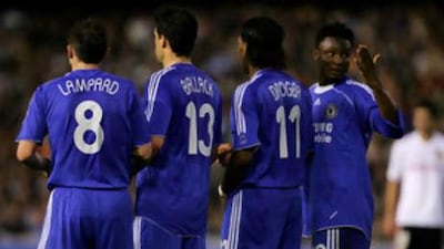 John Obi Mikel lines up a Chelsea wall, that includes three of the Premier League's biggest earners, from left, Frank Lampard, Michael Ballack and Didier Drogba.