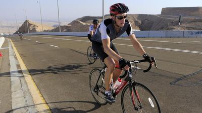 In the build up to the Abu Dhabi Tour, amateur riders make their way up to the peak of Jebel Hafeet yesterday in Al Ain. The climb covers 11.7 kilometres over grades varying from 8 degrees to 12 and is estimated to take 29 minutes to complete. Ravindranath K / The National