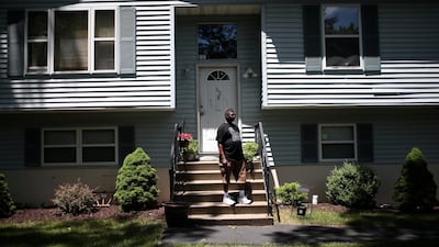 Michael Payne stands in front of his home in the Penn Estates development where most of the homeowners are underwater on their mortgages in Pennsylvania, US. Photo: Reuters