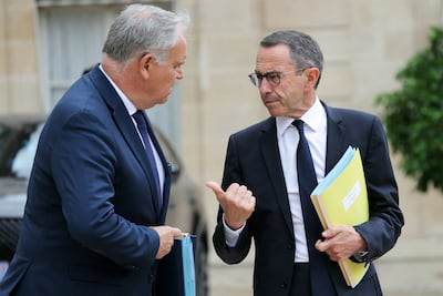 French Interior Ministers Bruno Retailleau and Francois-Noel Buffet in conversation after a cabinet meeting in Paris. AFP
