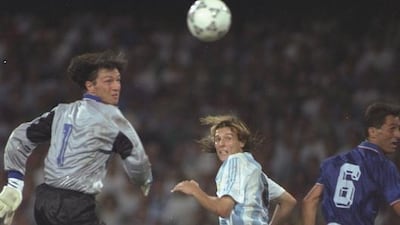 Claudio Canniggia, centre, of Argentina heads the ball past Walter Zenga the Italian goalkeeper during the 1990 World Cup semi-final at the San Paolo stadium in Naples, Italy. The match ended in a 1-1 draw but Argentina won 4-3 on penalties. David Cannon / Allsport