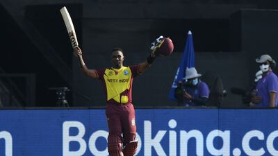 West Indies' Dwayne Bravo raises his bat as he walks back to the pavilion after his dismissal. Bravo has already announced his retirement. AFP