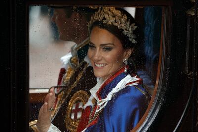 Kate, Princess of Wales waves to crowds of royal fans after the coronation ceremony. AP
