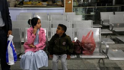 A Yemeni girl and boy wait in the departure lounge at Sanaa International airport, in Yemen. AP Photo