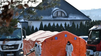 Medical staff work at a mink farm in a village near Kartuzy, northern Poland. EPA