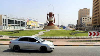 A giant artwork of a traditional lamp provides the centrepiece for this roundabout in Dibba.