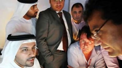 At least 60,000 visitors from around the world are expected to attend Cityscape this year. Khalil Mohammed Edrahim, left, a sales advisor for Aldar, was inundated with queries at the Abu Dhabi exhibition earlier this year.