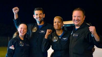 The crew was the first to circle the Earth without a professional astronaut. AP