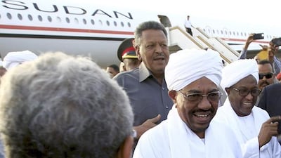 Sudanese president Omar Al Bashir, centre, is welcomed by supporters and government officials at the airport in Khartoum after his return from an African Union conference in Johannesburg, South Africa, on June 15, 2015. Mohamed Nureldin Abdallah / Reuters