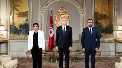 Sihem Boughdiri Nemsia during signing in ceremony with President Saied, alongside Nizar Bennaji.