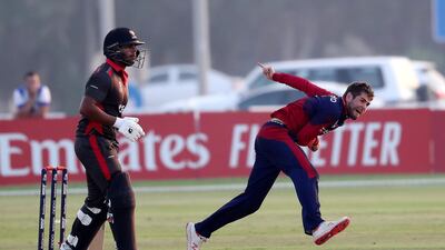 Charles Perchard of Jersey bowls to a UAE batsman.