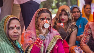 A women who supports 'Akhil Bharat Hindu Mahasabha' drink a tea concoction that the party claims stops the spread of the coronavirus despite no medical evidence. Getty Images
