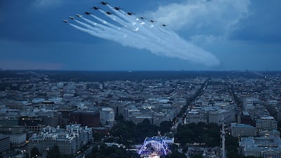 The US Air Force's demonstration squadron, the Thunderbirds, and the US Navy's Blue Angels perform a flyover during the UFC Freedom 250 mixed-martial arts event, at the White House, in Washington. AFP