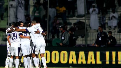 Al Ain players celebrate after Mohammed Ahmed's equaliser helped them come back from Al Shabab with a point. Satish Kumar / The National