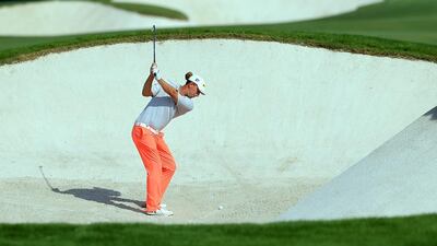 Marcel Siem of Germany takes a bunker shot during the first round of the DP World Tour Championship golf tournament at Jumeirah Golf Estates in Dubai, United Arab Emirates, 20 November 2014. EPA/YOSHUA ARIAS