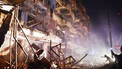 A Pakistani rescuer works at the site of the bomb blast in Karachi. Asif Hassan / AFP
