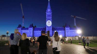 Queen Elizabeth's royal cypher is projected onto the Peace Tower on Parliament Hill in Ottawa, Canada. Reuters