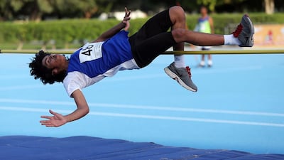 Khalid Mansoori competes in the high jump during the School Olympics at the Dubai Police Officers Club. Satish Kumar / The National