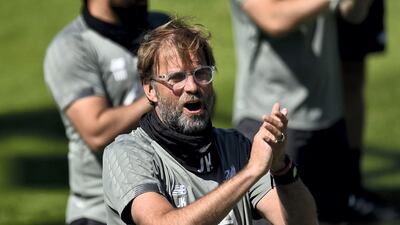 Manager Jurgen Klopp joins in the rendition of Happy Birthday. Getty