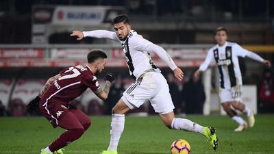 Juventus midfielder Emre Can takes on Torino midfielder Vittorio Parigini. AFP