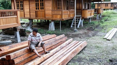 Buyers of Woloan houses have to shoulder the costs for transportation and customs fees, as well as travel costs of carpenters who will reinstall the house at site. Putu Sayoga / Getty Images