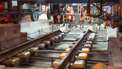 Construction workers mounting the last of 380,000 ties (in a golden colour) in the Gotthard Base Tunnel. The opening celebrations of the Switzerland’s the largest-ever construction project will start on June 1. Sigi Tischler / EPA