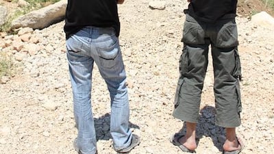 Nineteen-year-old Rami (right) was arrested by the Lebanese army last month at the Al Awde refugee camp near the town of Bar Elias for lacking proper residency papers. Rami's friend Mohammed (left) escaped arrest only after his mother begged soldiers not to take him. Josh Wood for The National.