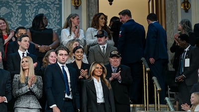 From left, Ivanka Trump, daughter and former senior adviser to Mr Trump, her brother Barron Trump, and the President's wife, Melania, at the address. Bloomberg