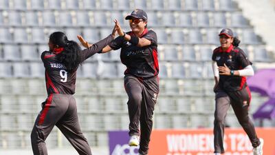 UAE's Vaishnave Mahesh celebrates after taking the wicket Pakistan batter Ayesha Naseem.