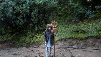 Harka Bahadur Silwal carries a trident on his way to Gosaikunda Lake. Narendra Shrestha/EPA