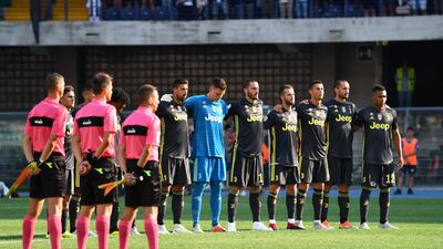 Juventus players stand for a minute of silence for the victims of Genoa's Morandi Bridge collapse. AFP