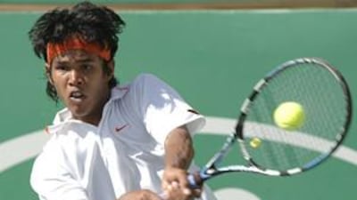 Somdev Devvarman returns the ball to Carlos Moya during their match at the Chennai Open.