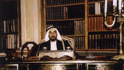Sheikh Zayed, in a rare moment at his desk, on the second anniversary of his accession.