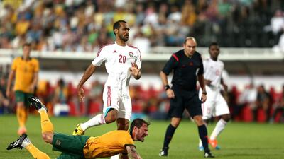James Troisi of Australia is tackled durng the international friendly between the UAE and Australia at Mohamed Bin Zayed Stadium on October 10, 2014 in Abu Dhabi, United Arab Emirates. Warren Little/Getty Images
