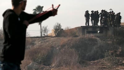 Palestinian protestors clash with Israeli security forces in the West Bank town of Tulkarem, following a demonstration against US president Donald Trump's decision to recognise Jerusalem as the capital of Israel. Jaafar Ashtiyeh / AFP Photo