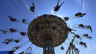 People on a swing ride at the State Fair of Texas in Dallas, Texas. Larry W Smith / EPA