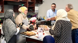 The Ghazzi family prepare kibbeh and lentil soup in a Syrian cooking demonstration at George Washington University