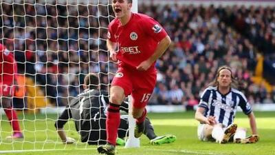 Callum McManaman celebrates his winning goal for Wigan Athletic.