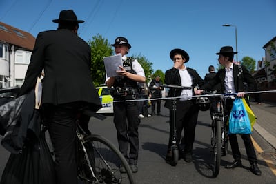 A police officer stands by a cordon at the scene of the stabbing. Reuters