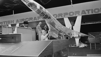 A worker cleans a transparent model of the supersonic passenger airliner Concorde at a British Aircraft Corporation exhibit at Farnborough Airshow in 1966.