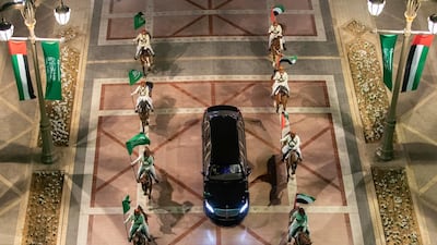 Mounted cavalry riders escort the motorcade of Prince Mohamed bin Salman upon his arrival at Qasr Al Watan.
