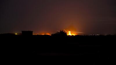 Tracer fire and explosions lights up the night sky as U.S.-backed Syrian Democratic Forces (SDF) fire on Baghouz, Syria, Sunday, March 10, 2019. AP