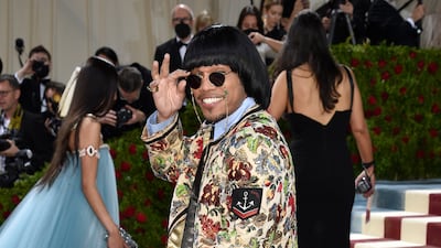 Anderson .Paak, wearing a floral jacket and leather trousers. AP Photo