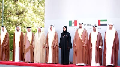 UAE delegates observe a ceremony following the arrival of Sheikh Mohammed. WAM