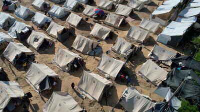 Tents provided by the UN – to house Palestinians displaced by the Israeli bombardment of Gaza – dot the landscape in Khan Younis. AP
