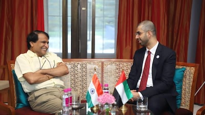 Omar Al Olama, Minister of State for Artificial Intelligence, and Deepak Bagla, managing director and chief executive of Invest India, form the India-UAE Artificial Intelligence Bridge. Courtesy Ministry of Cabinet Affairs and Public Diplomacy Office