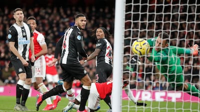 Newcastle goalkeeper Martin Dubravka fails to stop Pierre-Emerick Aubameyang's header. AP