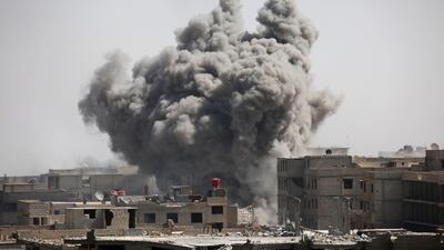 Smoke rises from buildings following airstrikes in Eastern Ghouta, on the outskirts of the Syrian capital Damascus on March 21, 2018. Amer AlMohibany / AFP 