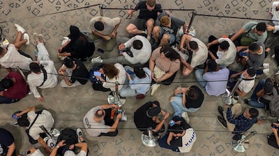 People queue for the iPhone 15 at Mall of the Emirates in Dubai. Antonie Robertson / The National